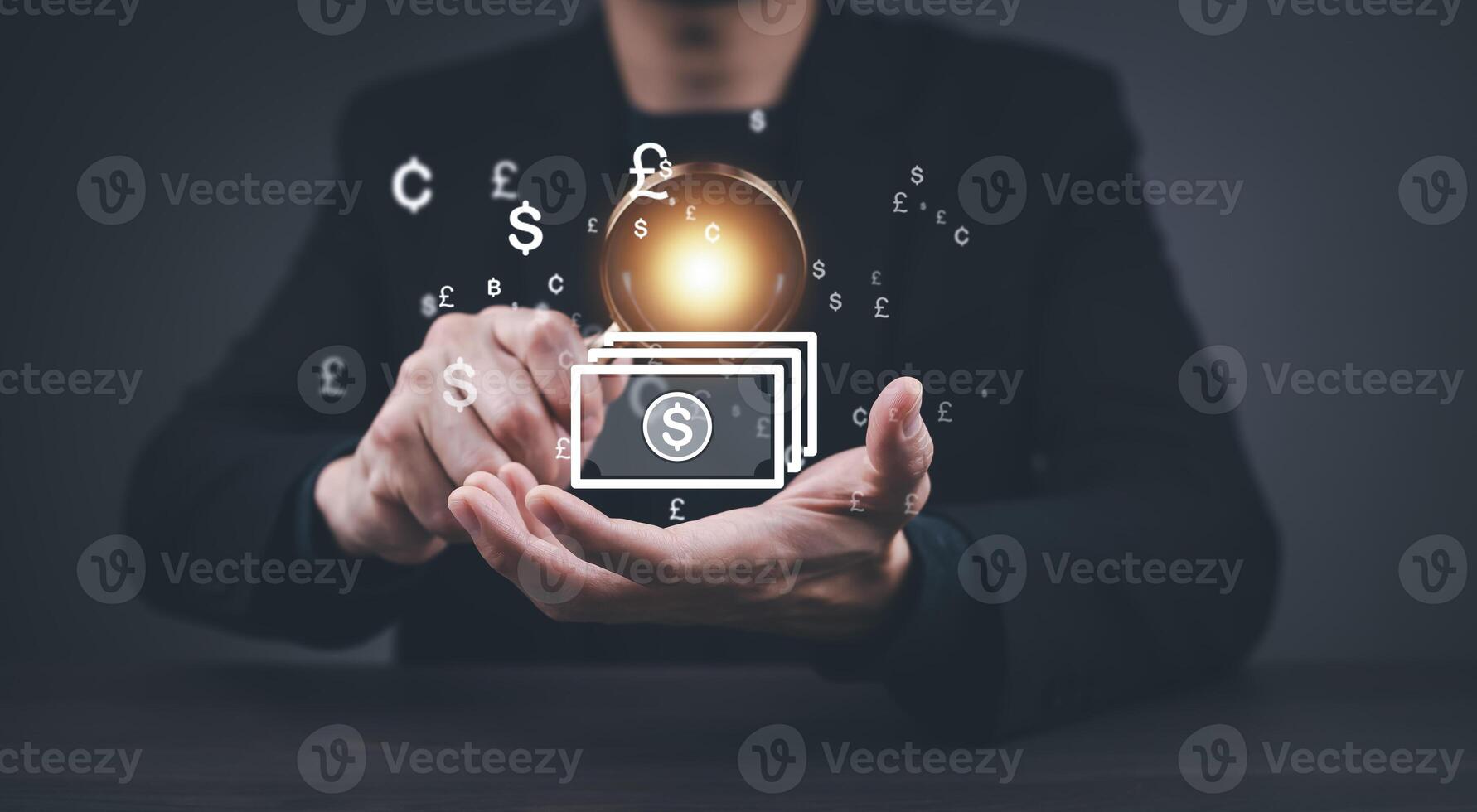 Businessman holding virtual bank with currency sign for forex exchange and global money transfer by technology concept. photo