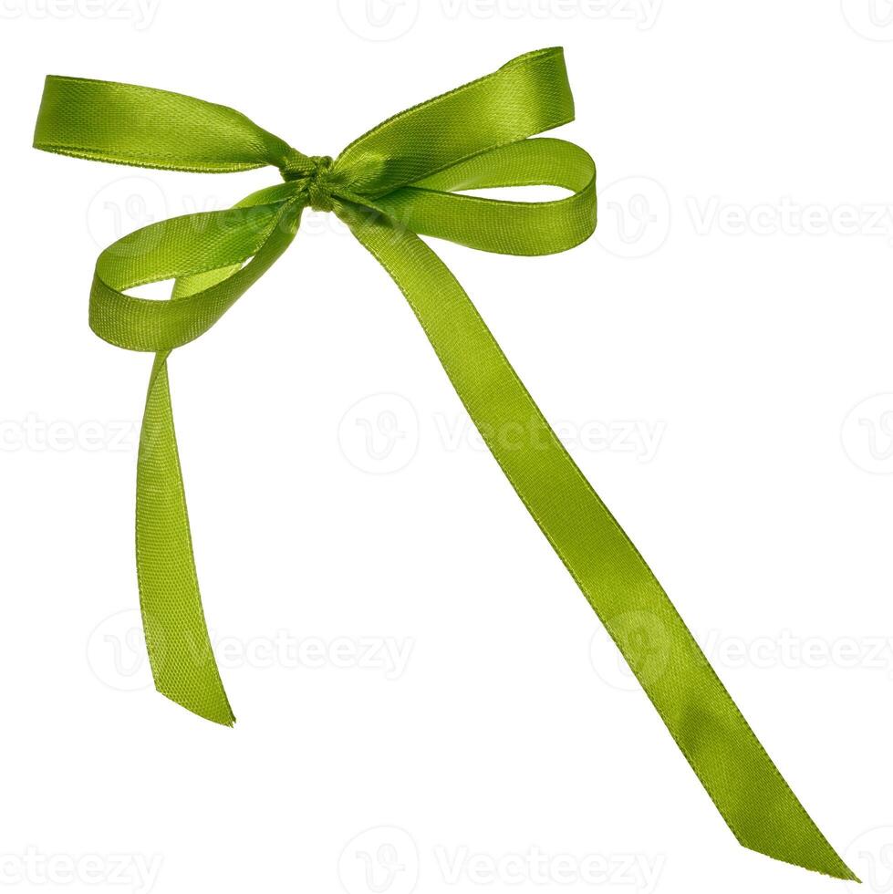 Tied green silk ribbon in a bow on an isolated background, decor for a gift photo