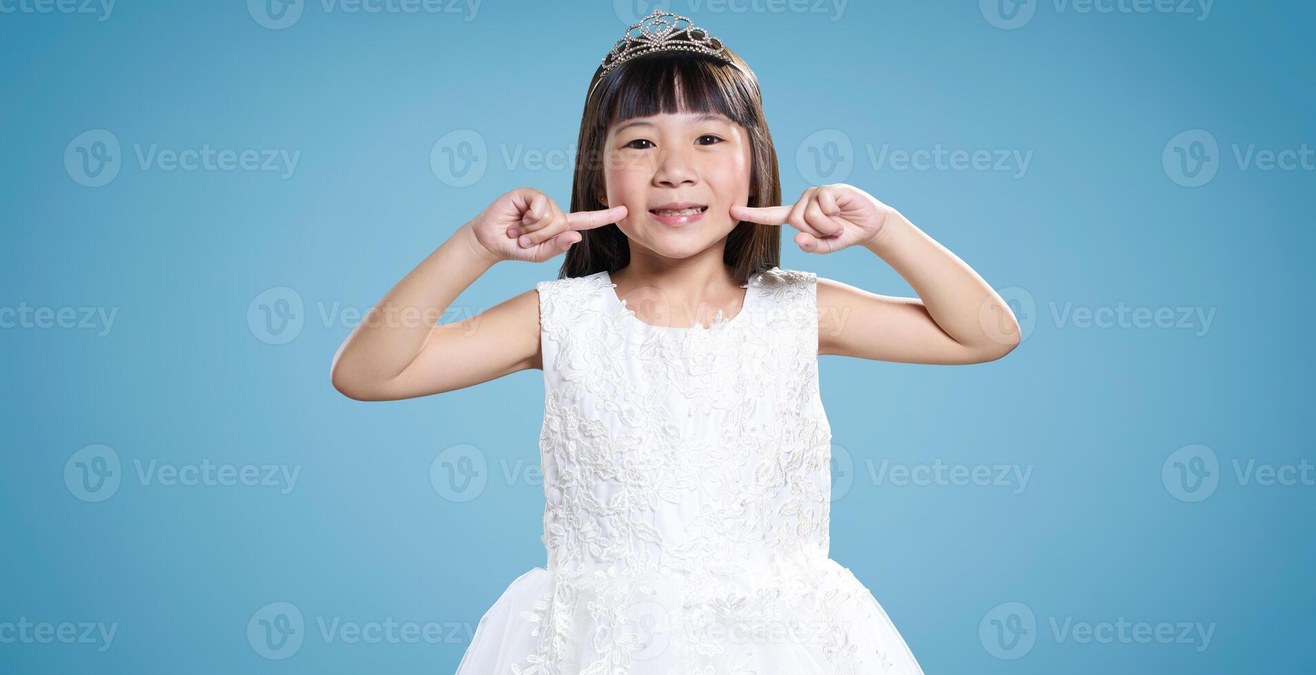 Little princess in white dress smiling photo