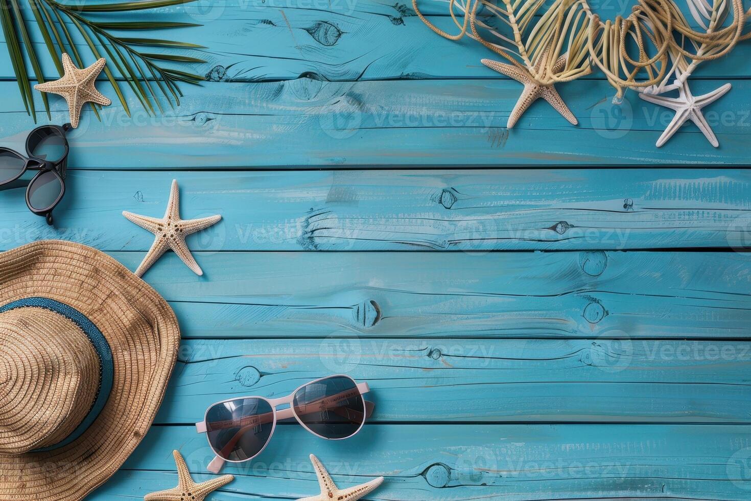 top view beach accessories on blue wooden background with copy space photo