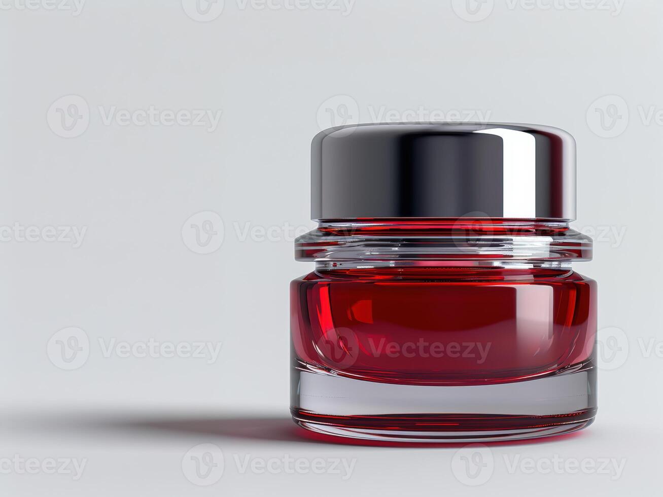 a red liquid bottle with a silver lid photo