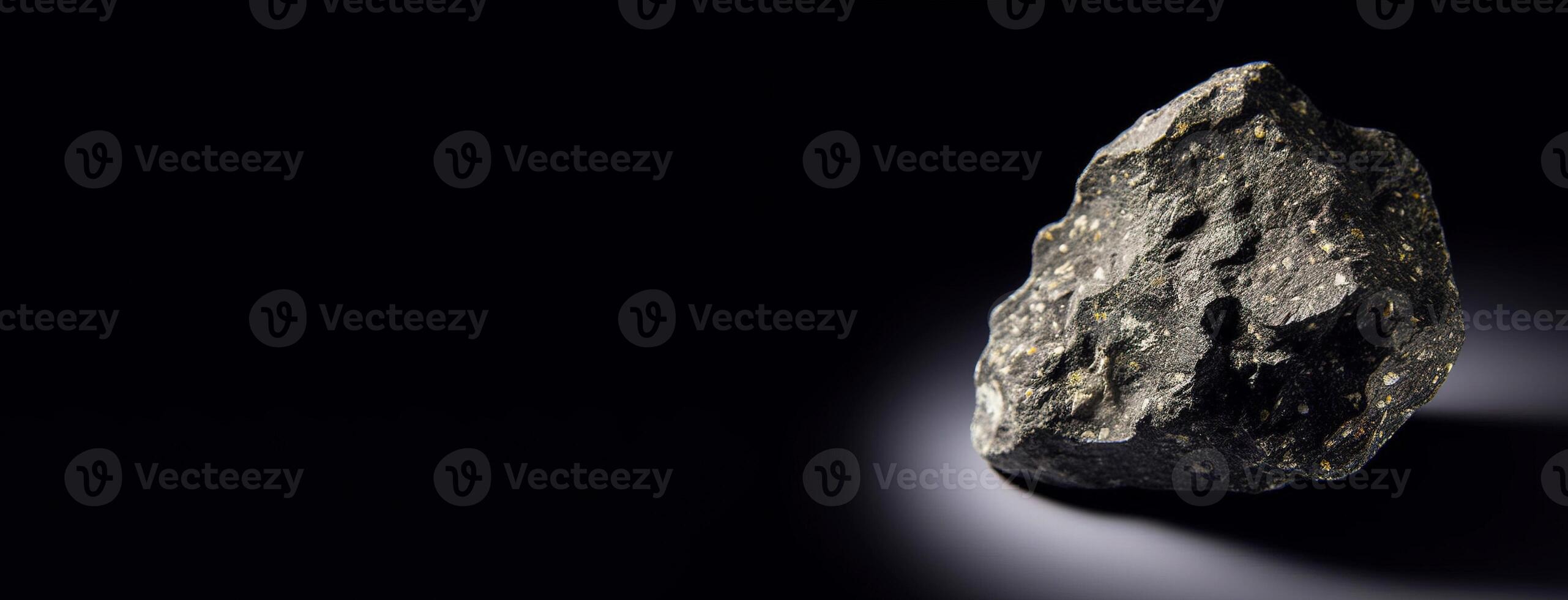Leucite is a rare precious natural stone on a black background. . Header banner mockup with space. photo