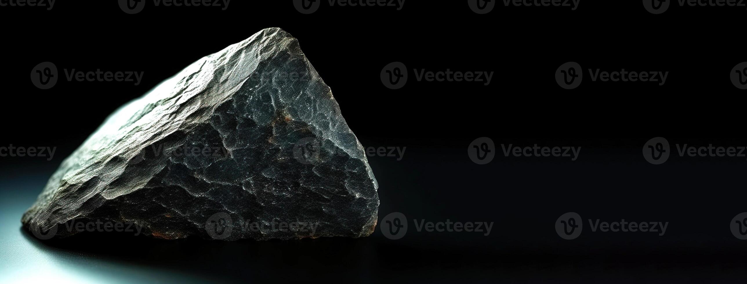 Ottrelite fossil mineral stone. Geological crystalline fossil. Dark background close-up. photo
