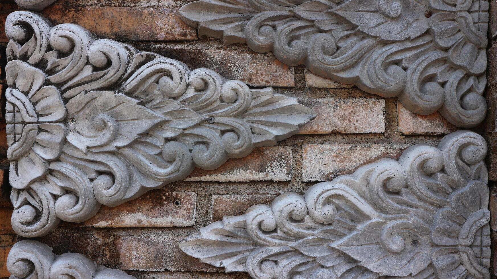 cement carving texture background on garden wall photo