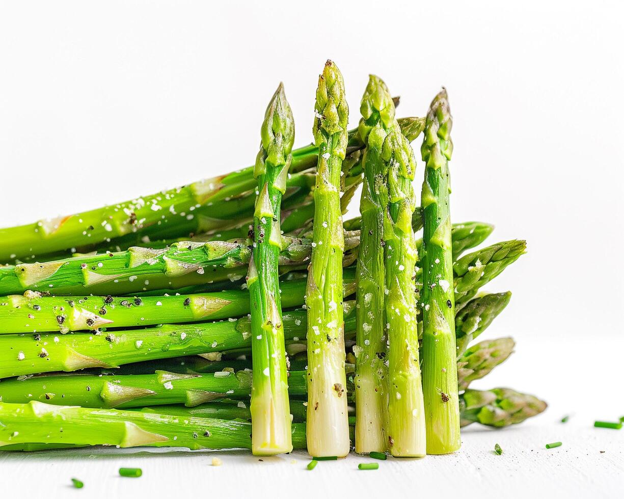 a bunch of asparagus spears on a white table photo