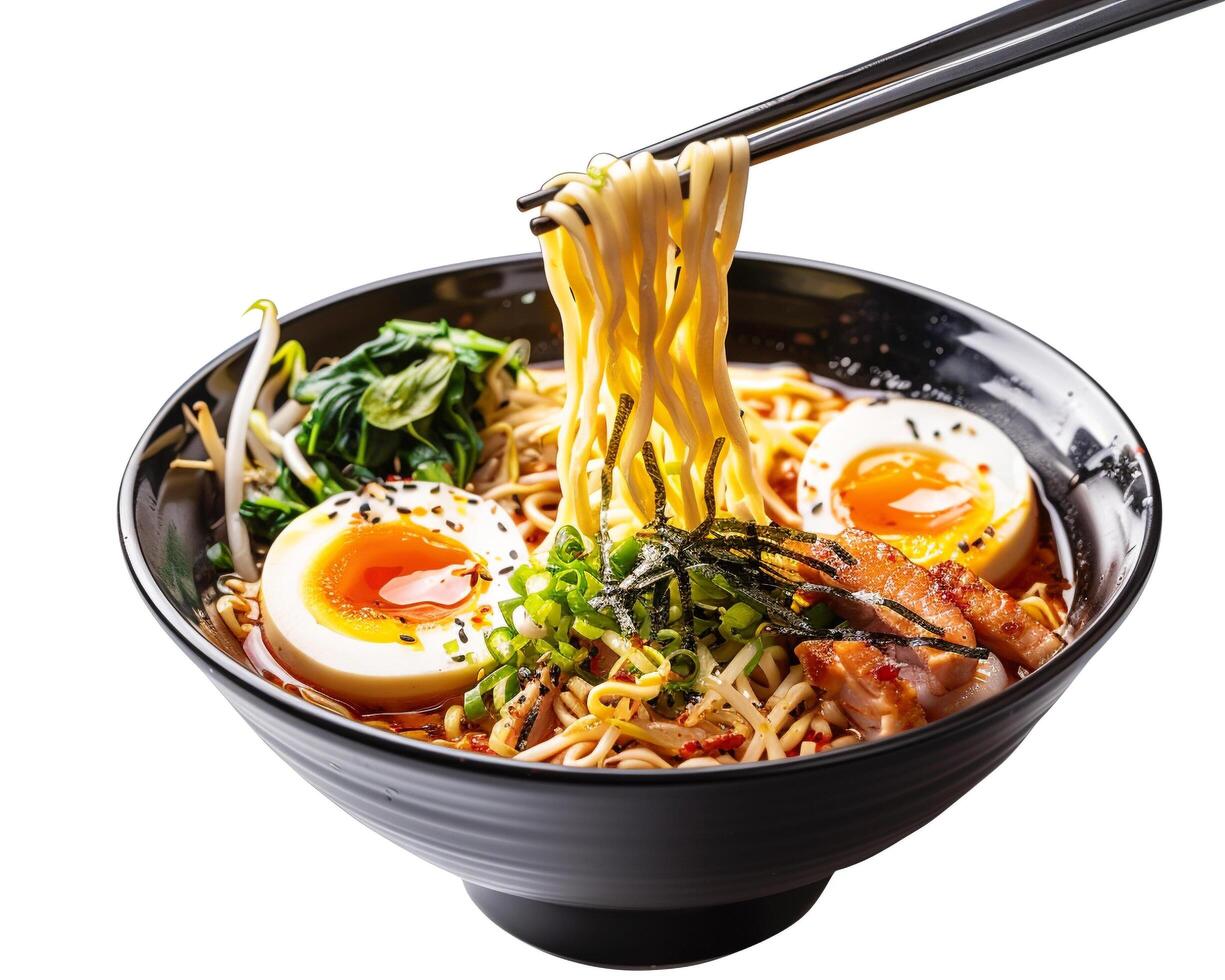 a bowl of ramen with chopsticks holding an egg photo
