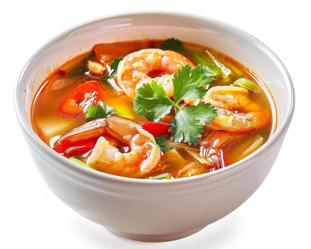 a bowl of soup with shrimp and vegetables photo