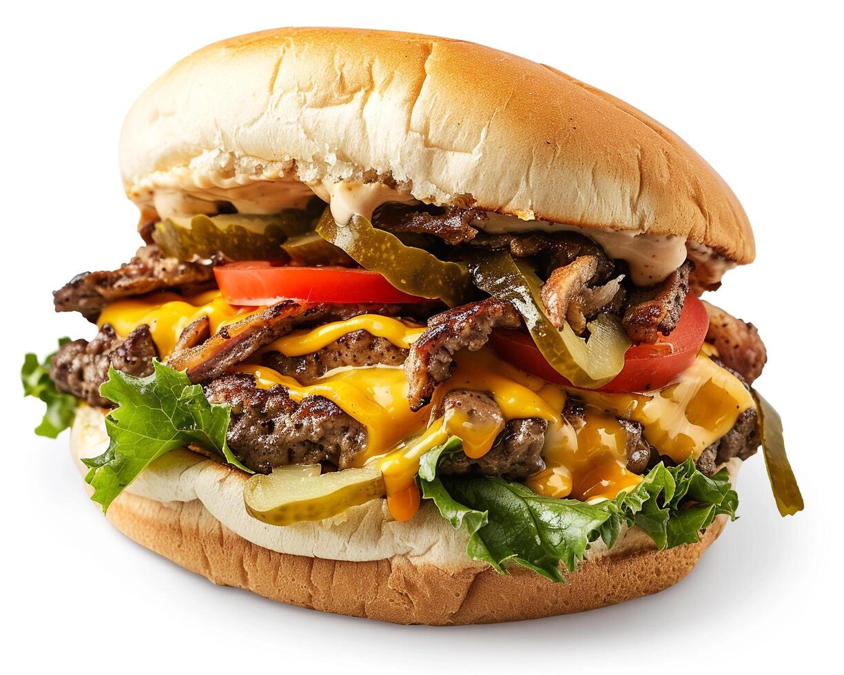 a large hamburger with cheese, pickles, and tomatoes photo