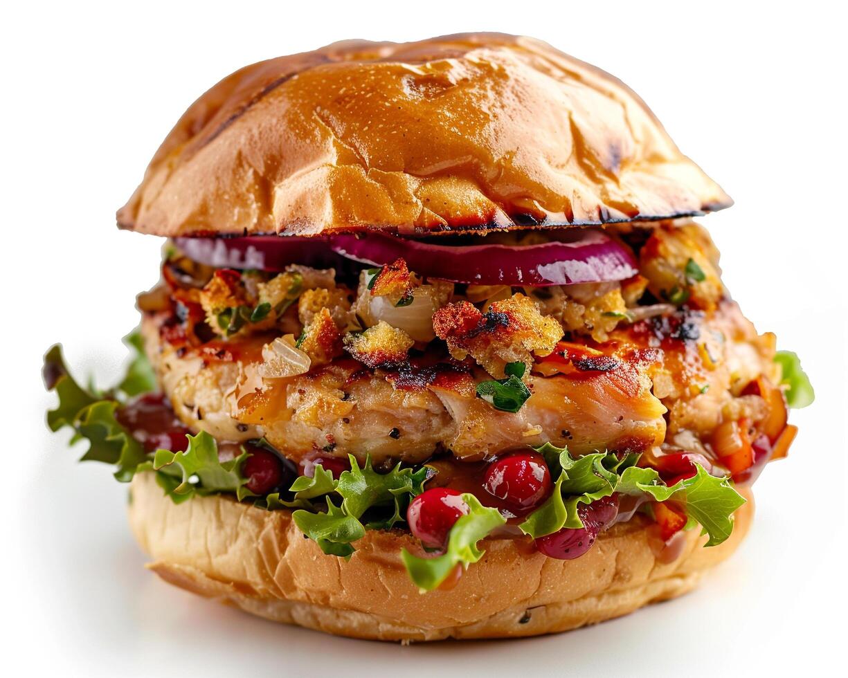 a close up of a burger with lettuce, onions and cranberries photo