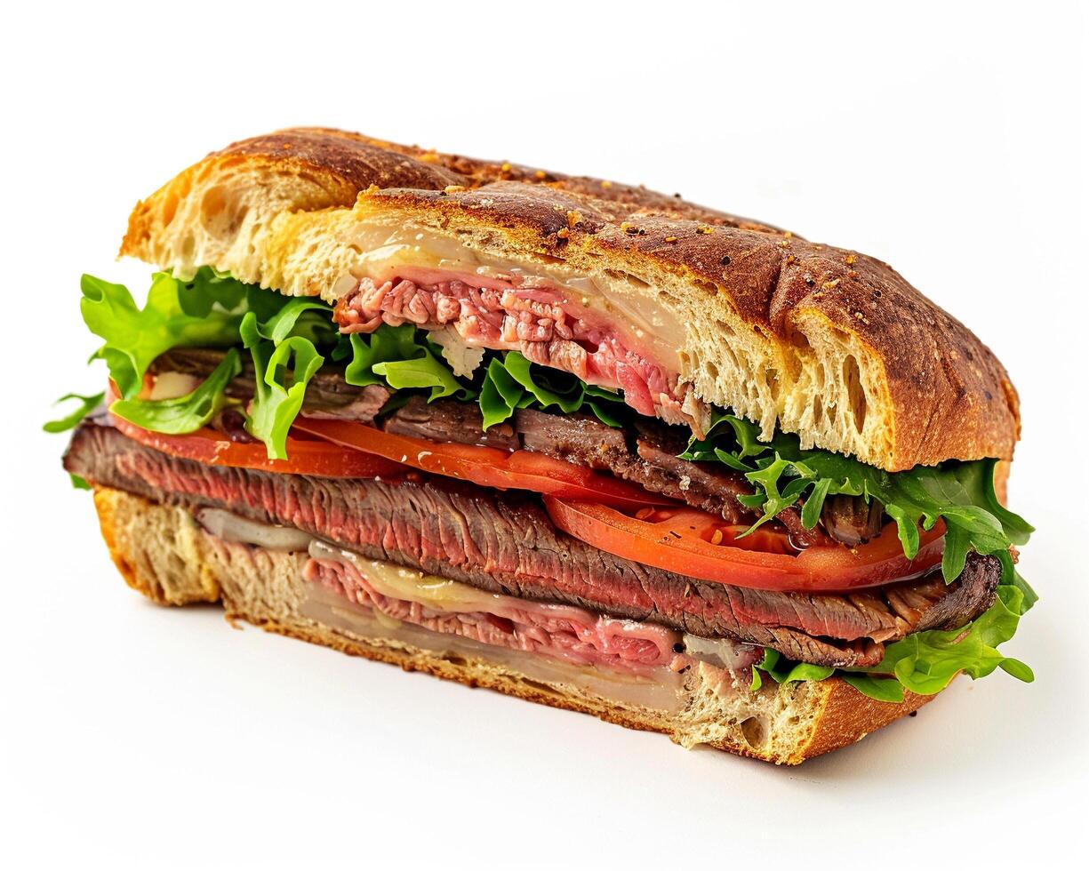 a sandwich with meat and vegetables on a white surface photo