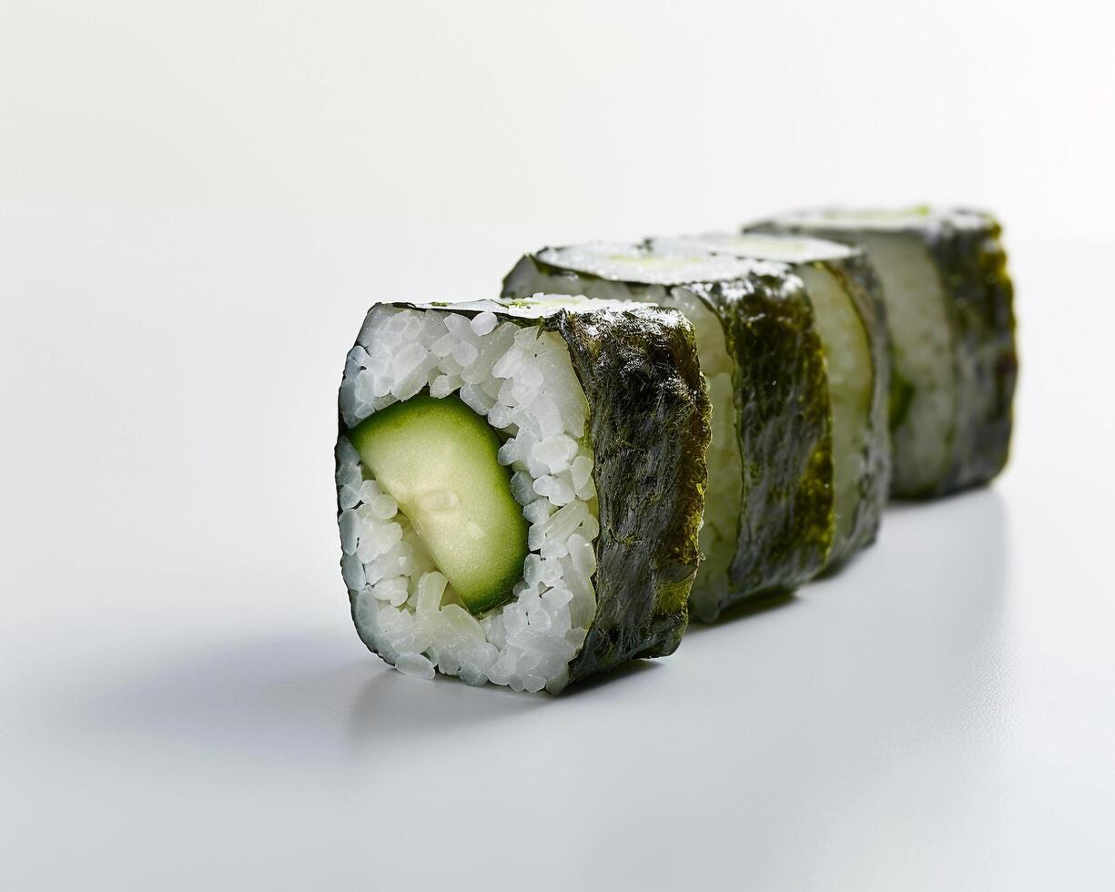 a sushi roll with cucumber slices on it photo