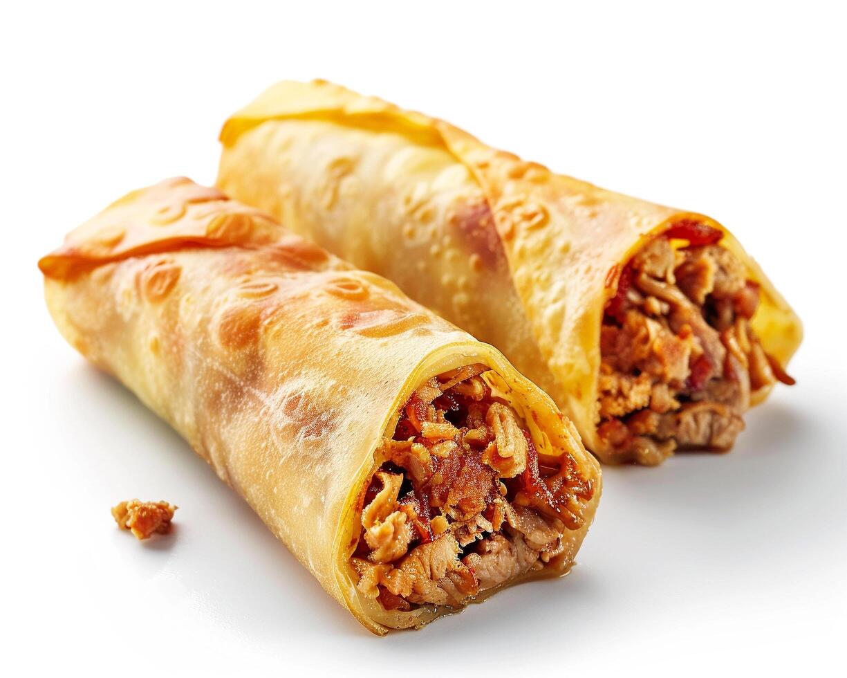 two chicken and cheese wraps on a white surface photo