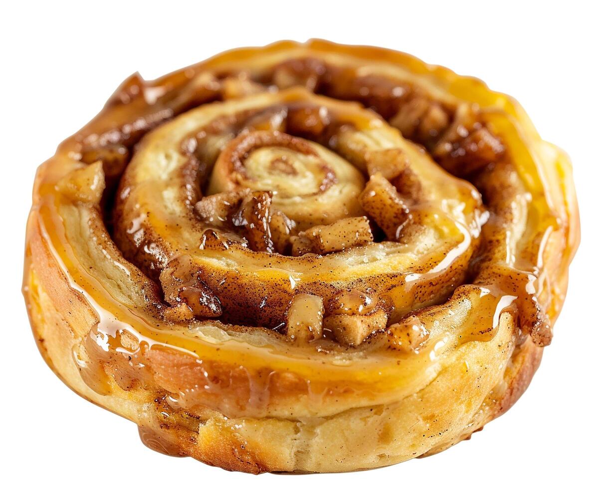 a cinnamon roll with caramel and walnuts on top photo