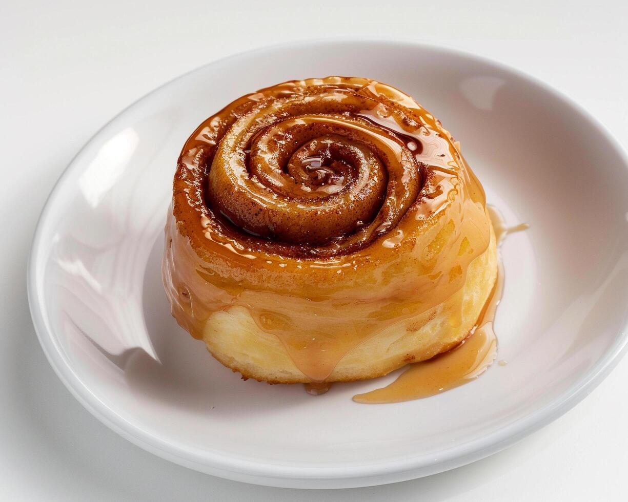 a cinnamon roll on a white plate photo