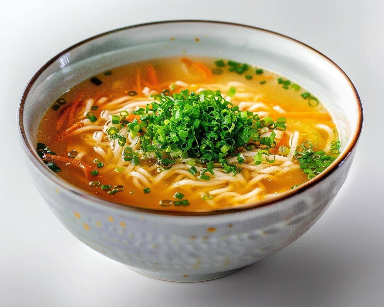 a bowl of soup with noodles and vegetables photo
