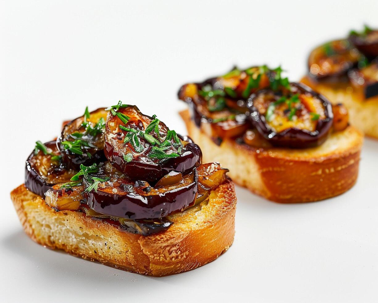 Two small pieces of bread with a variety of food on them photo