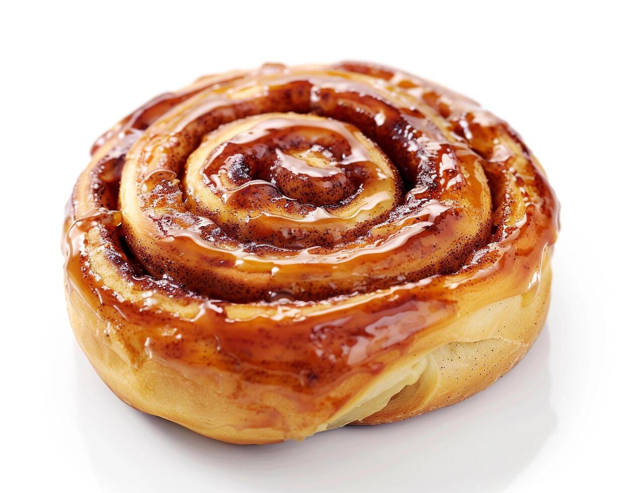 a cinnamon roll on a white surface photo