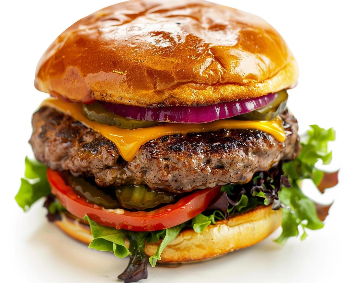 a hamburger with cheese, lettuce, and tomato photo