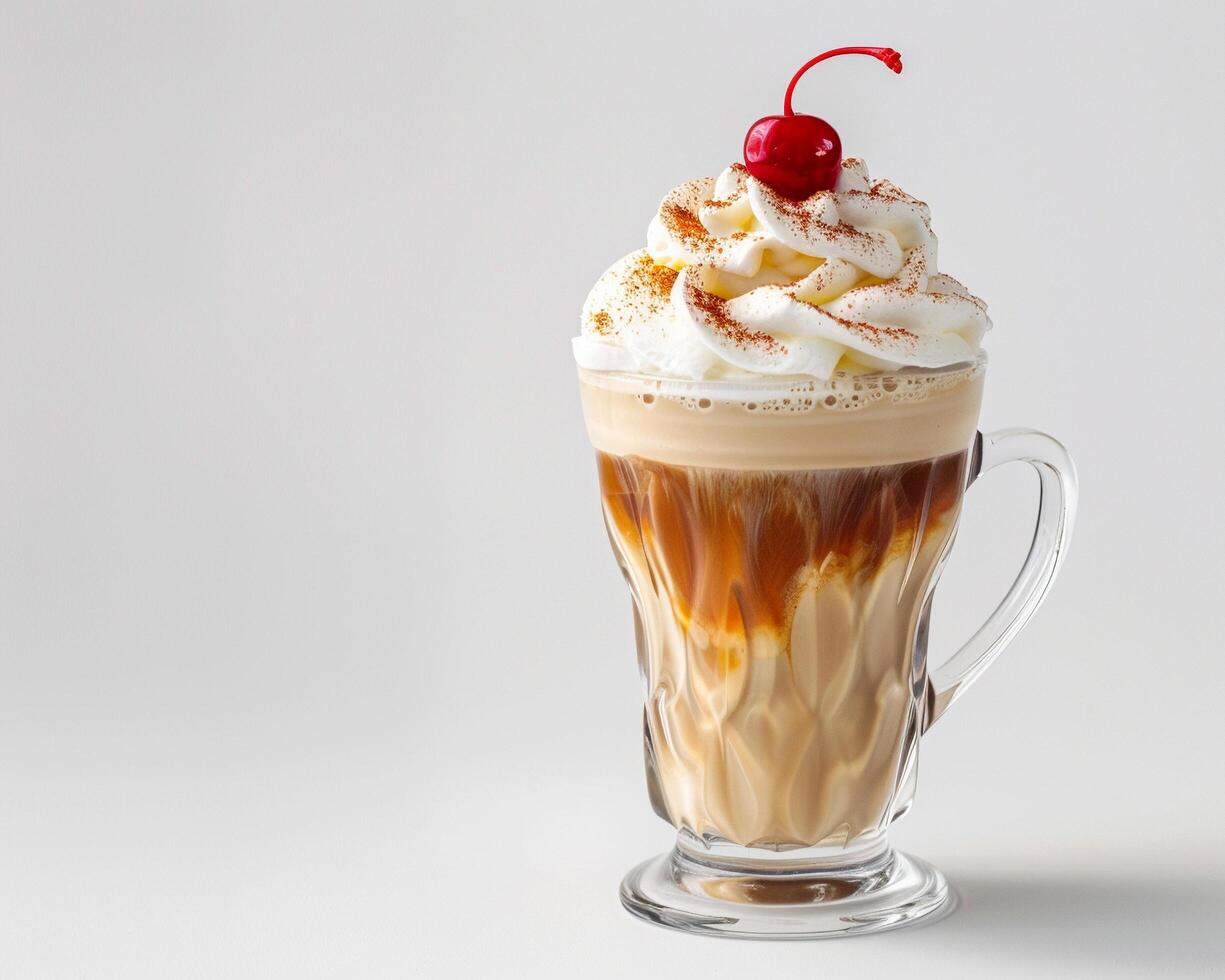 a coffee drink with whipped cream and a cherry on top photo