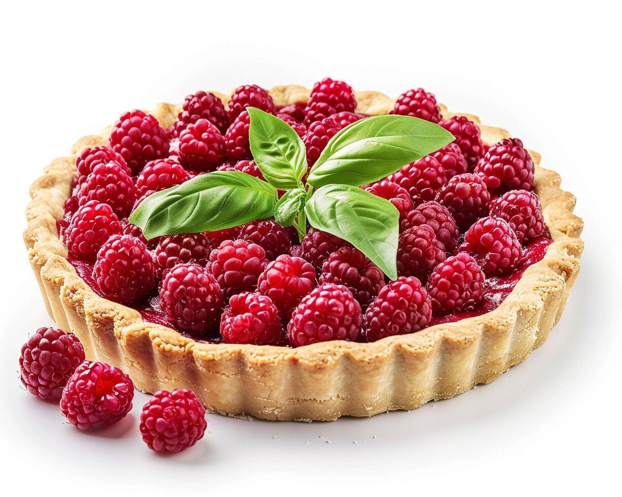 a raspberry tart with basil leaves on top photo