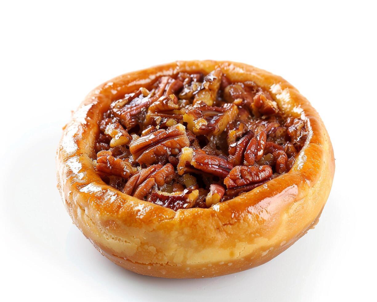 A pastry with nuts on top photo