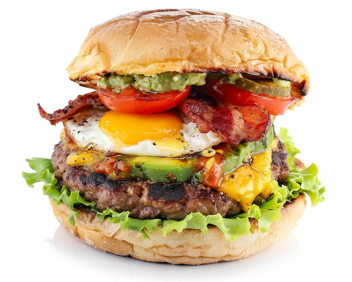 a hamburger with bacon, eggs, and tomatoes photo