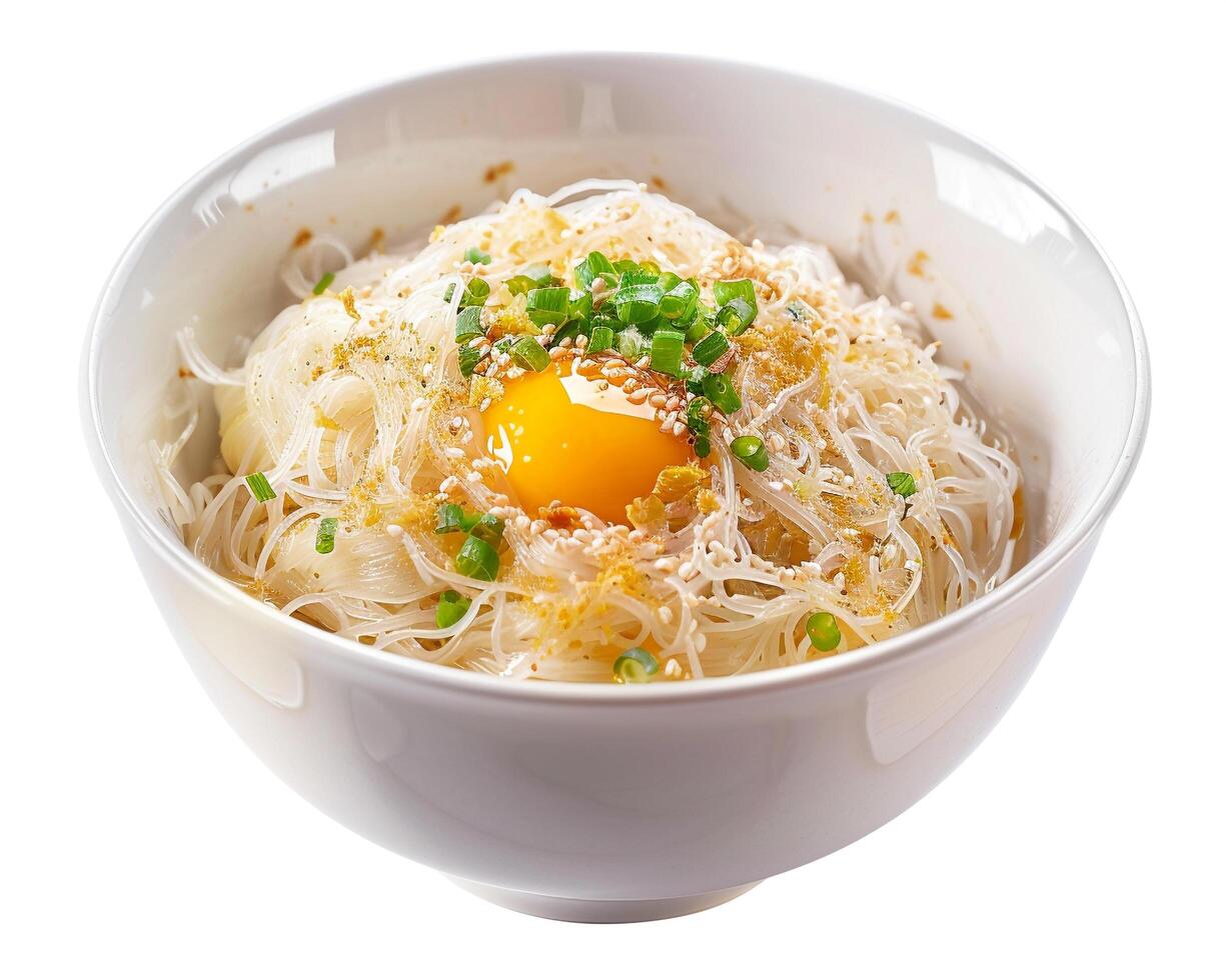 a bowl of noodles with an egg in it photo