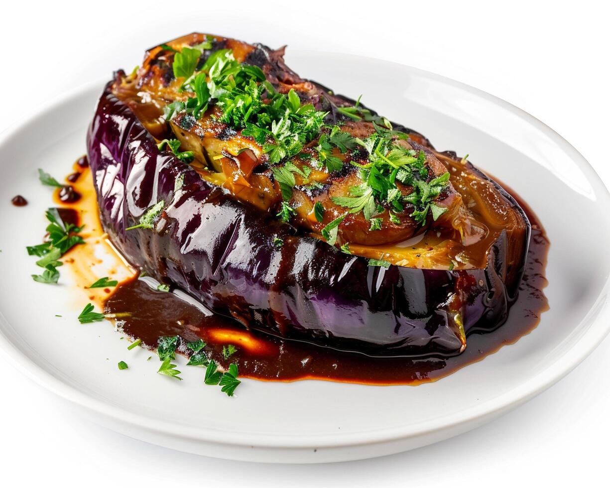 a plate topped with an eggplant stuffed with sauce photo