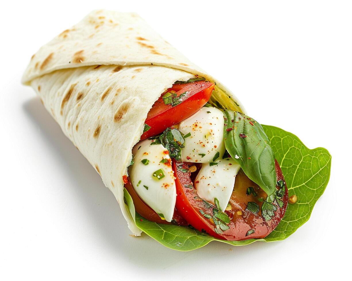 a wrap with tomatoes and mozzarella cheese photo