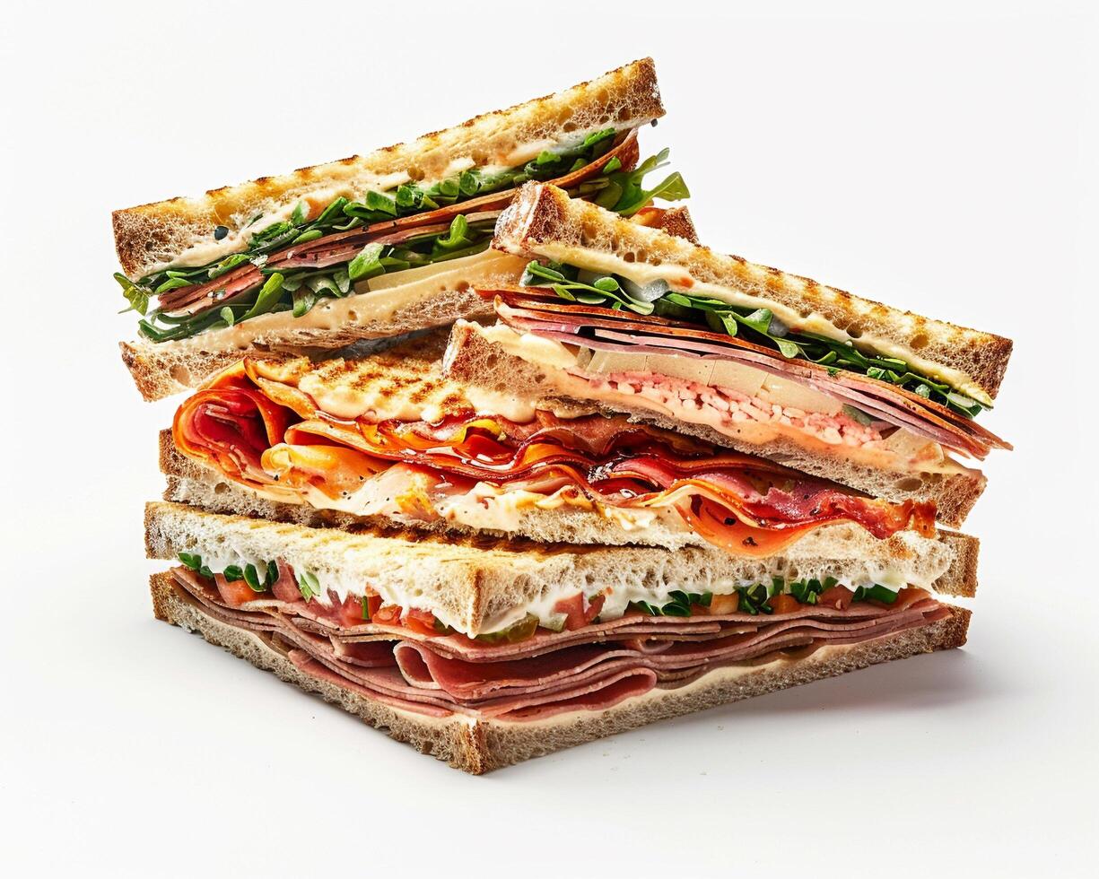 a stack of sandwiches with meat, cheese and vegetables photo