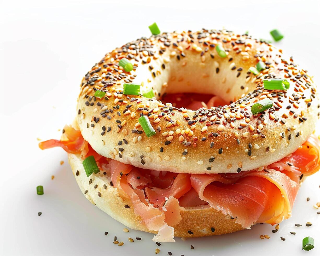 a bagel with meat and cheese on it photo