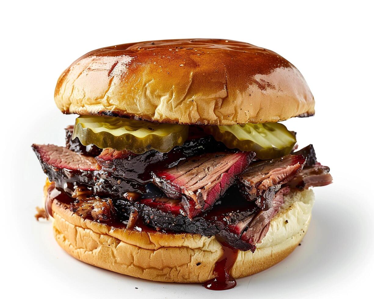 a bbq sandwich with pickles and meat on a bun photo