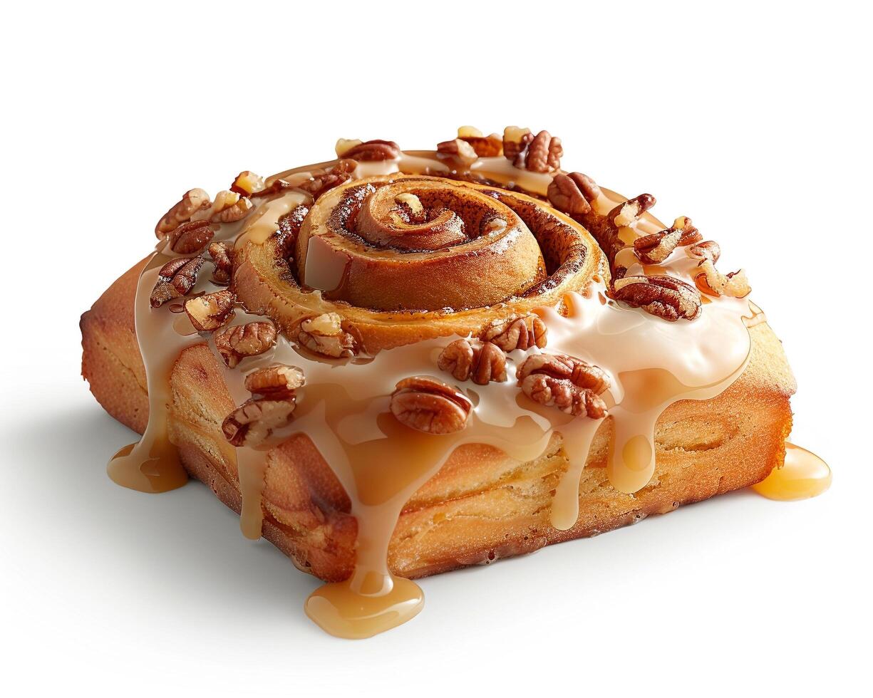 a cinnamon roll with caramel and pecans photo