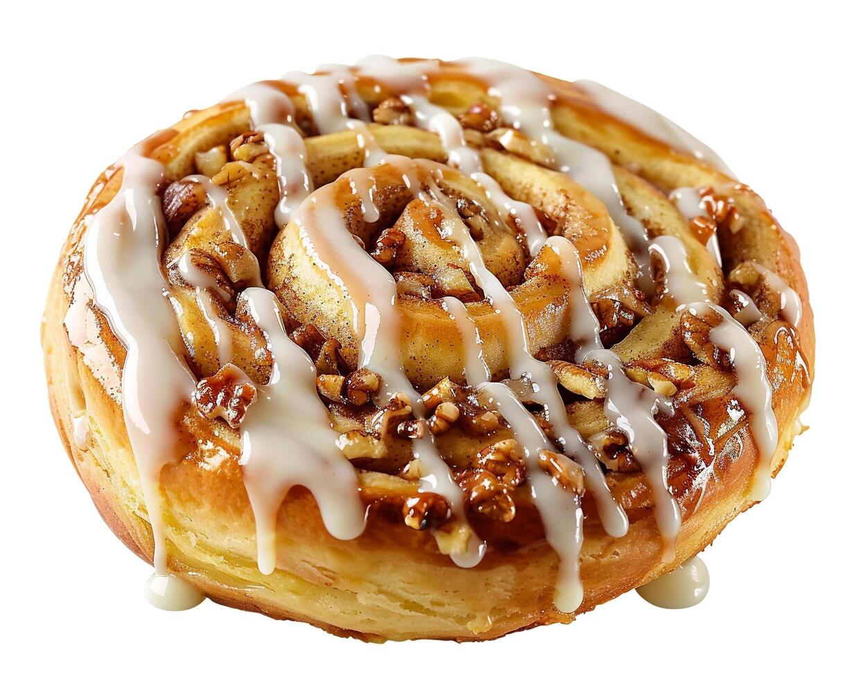 a cinnamon roll with icing and nuts on top photo