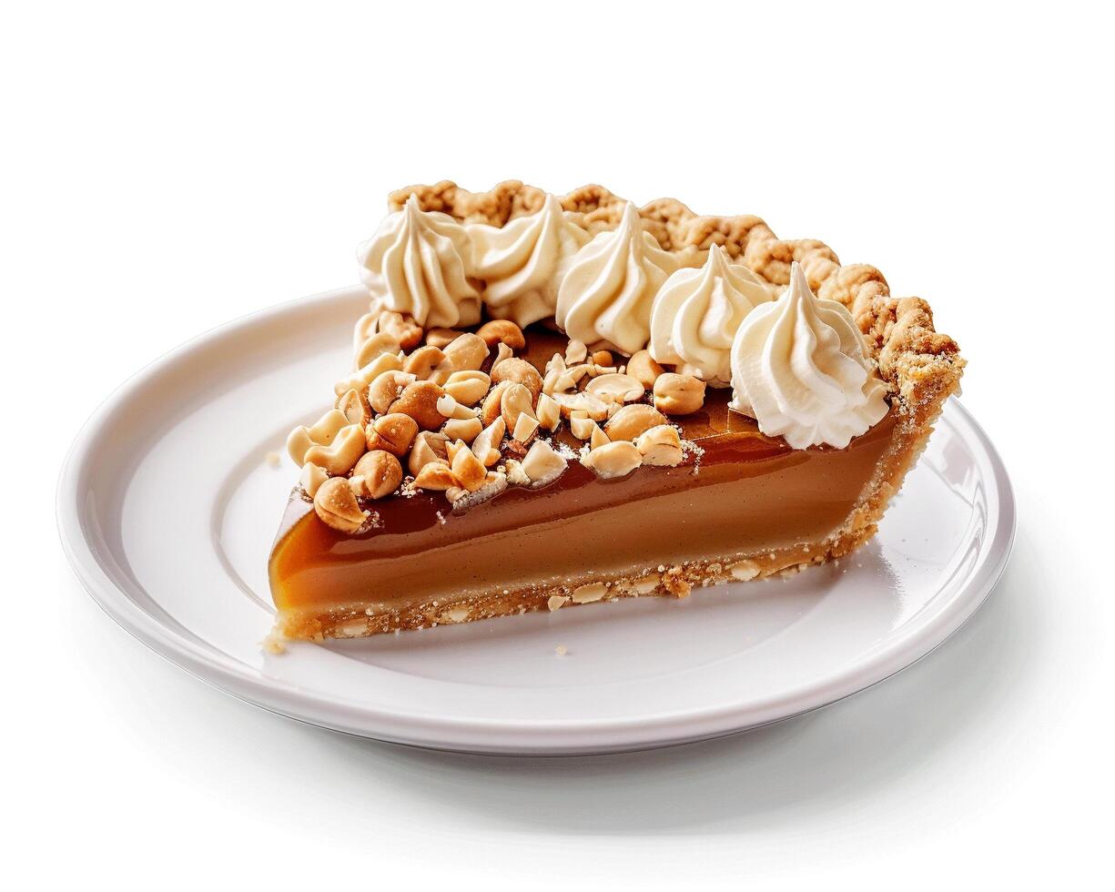 a piece of pie with caramel and nuts on a white plate photo