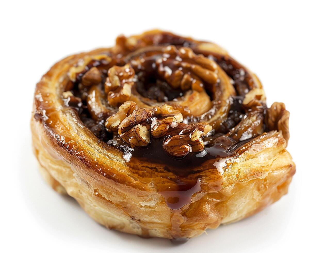 a pastry with walnuts and caramel on top photo