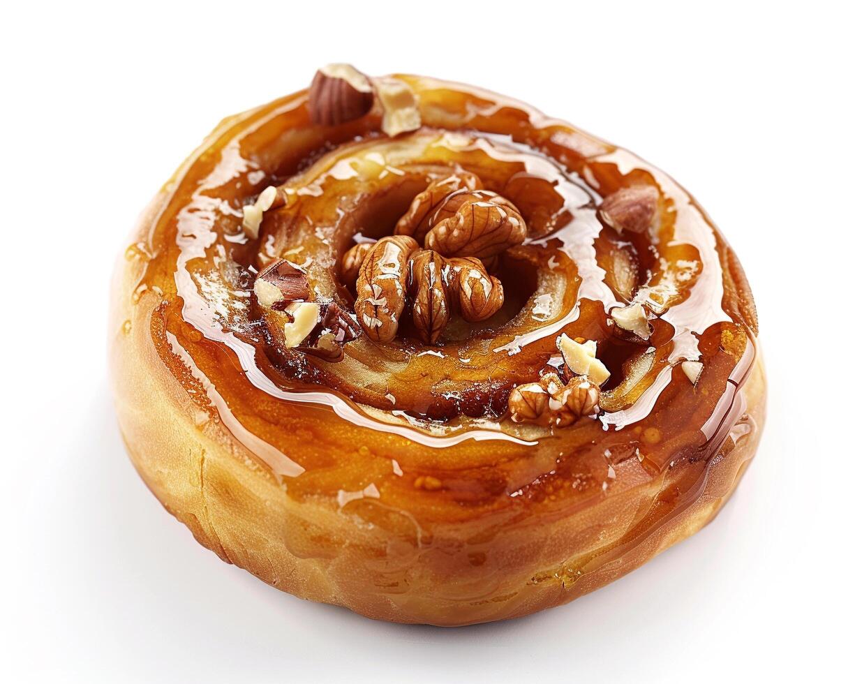 a pastry with walnuts and caramel on top photo