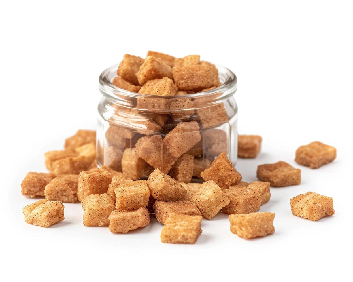 a glass jar filled with brown sugar cubes photo