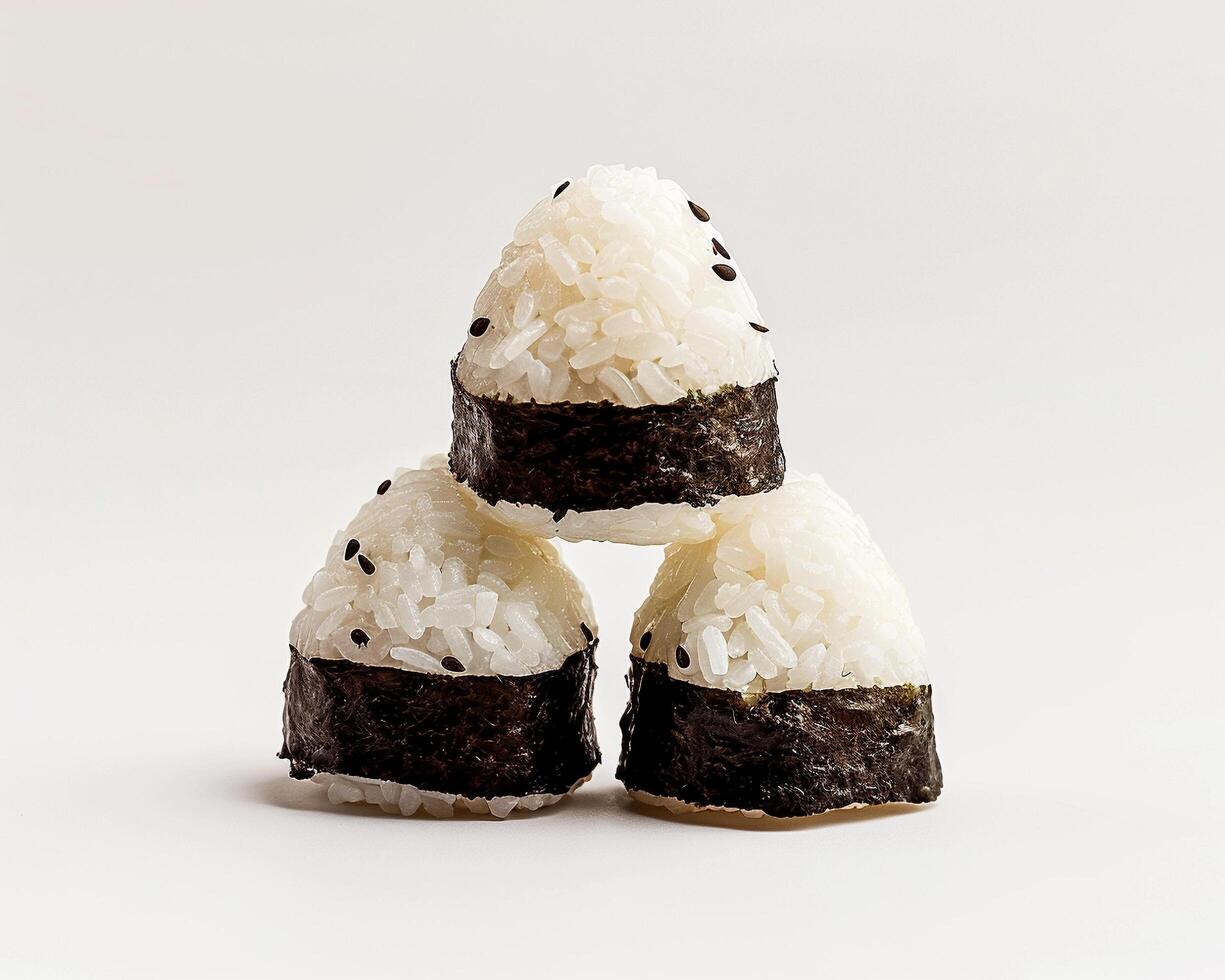 three pieces of sushi are stacked on top of each other photo