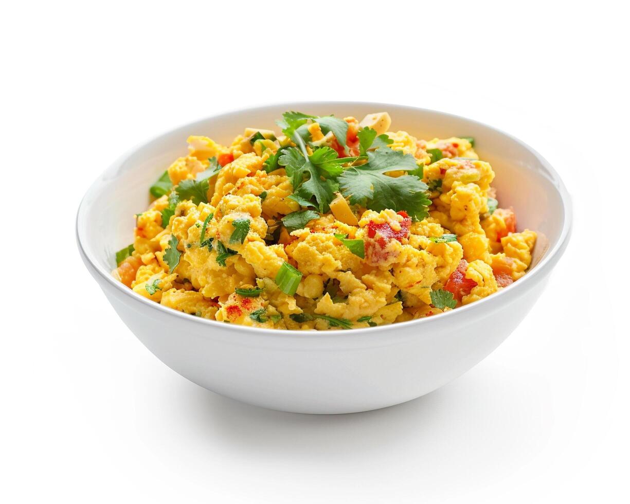 a bowl of scrambled eggs with cilantro on a white background photo