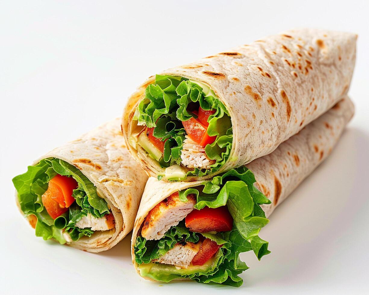 a chicken wrap with lettuce and tomatoes photo