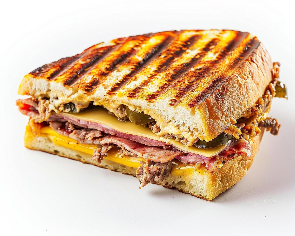 a sandwich with meat and cheese on a white surface photo