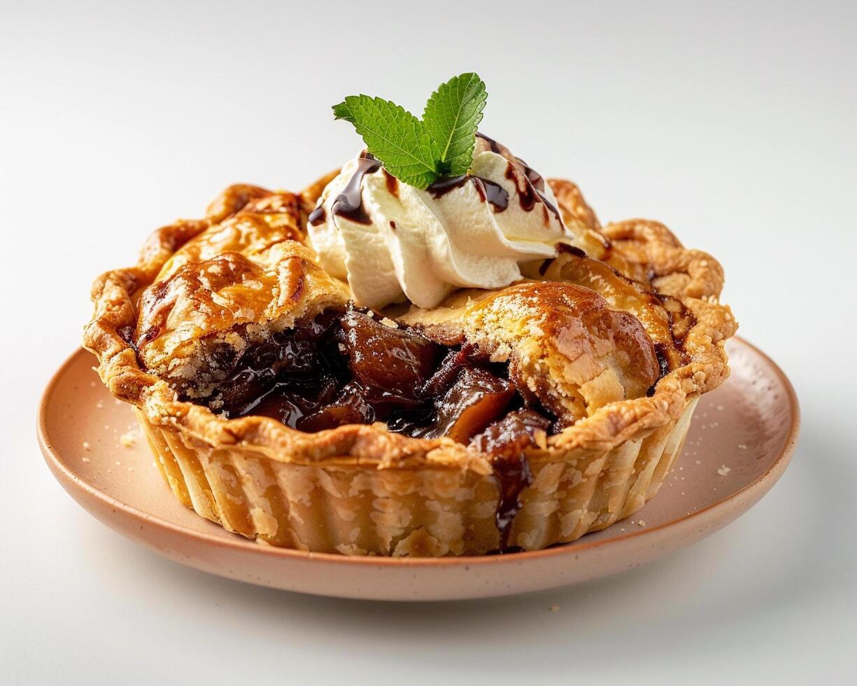 a pie with ice cream and a mint leaf photo
