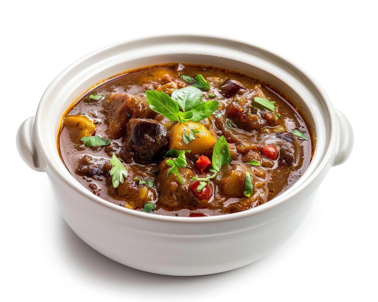 chicken curry in a white bowl with herbs and spices photo