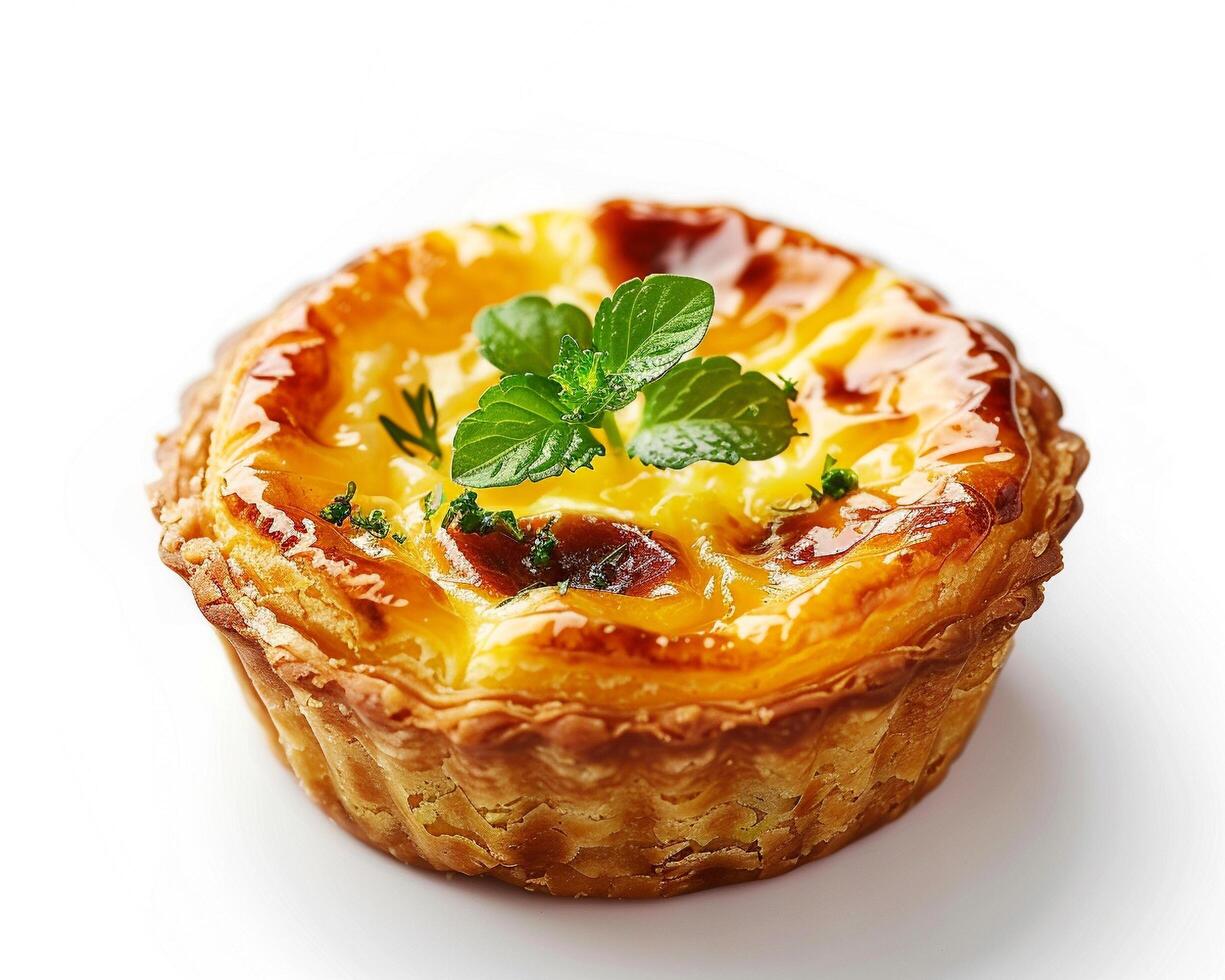 a small pastry with cheese and herbs on a white surface photo