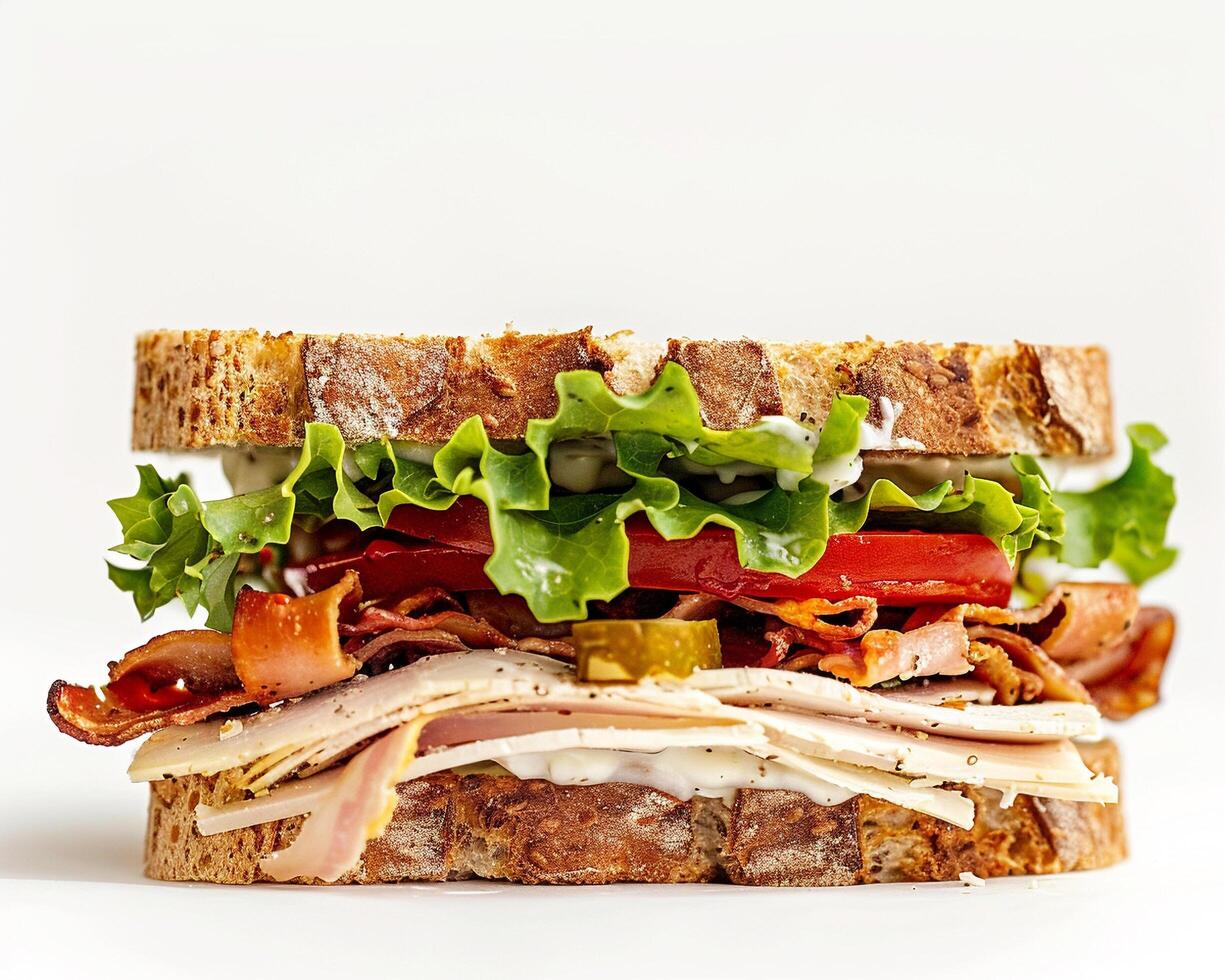 a sandwich with meat, lettuce, and tomato photo