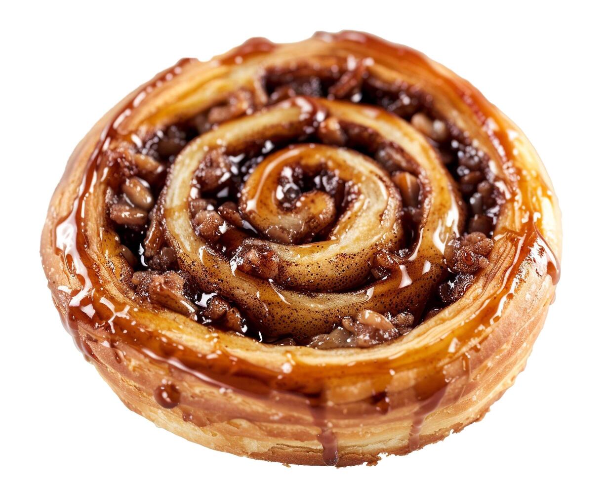 a pastry with caramel and nuts on top photo