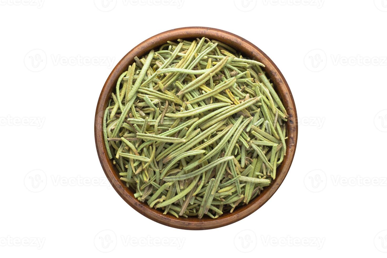 dried rosemary spice in wooden bowl, isolated on white background. Seasoning top view photo