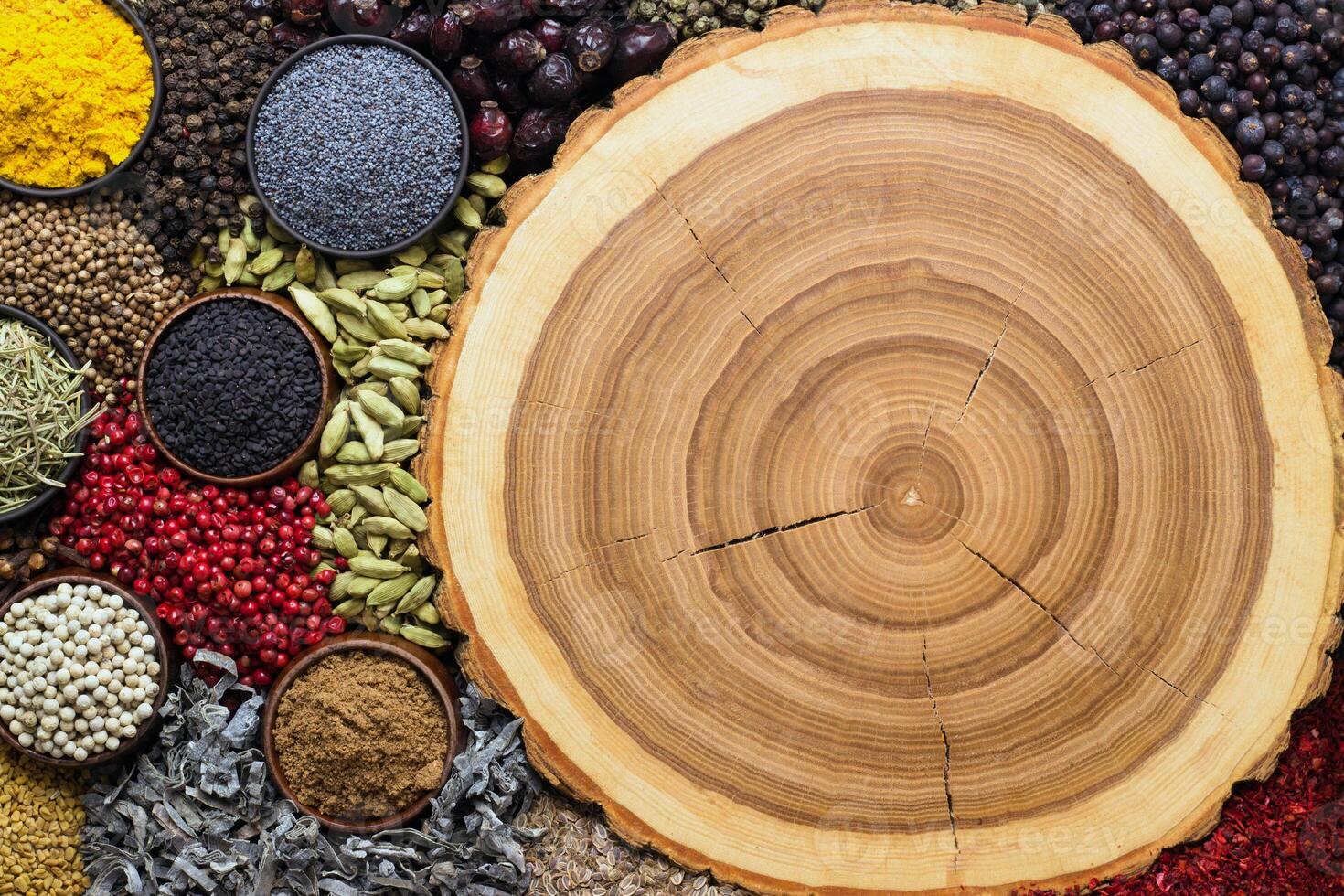 Spices for packaging design with food. Indian condiments on background of wooden texture. photo
