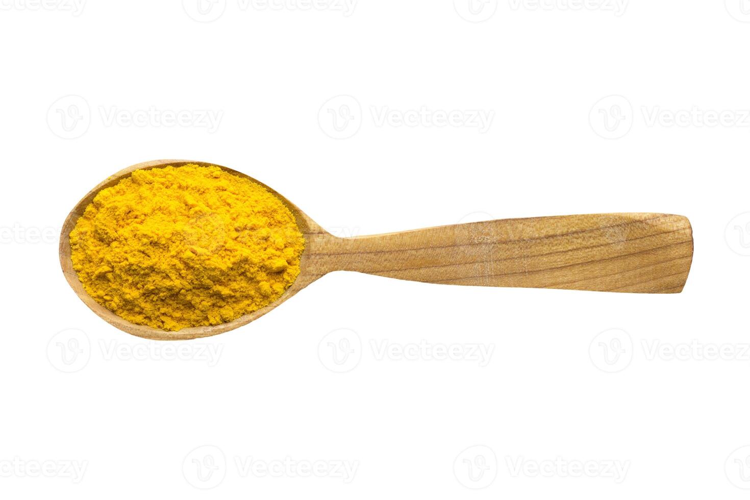 saffron powder in wooden spoon isolated on white background. spice for cooking food, top view. photo